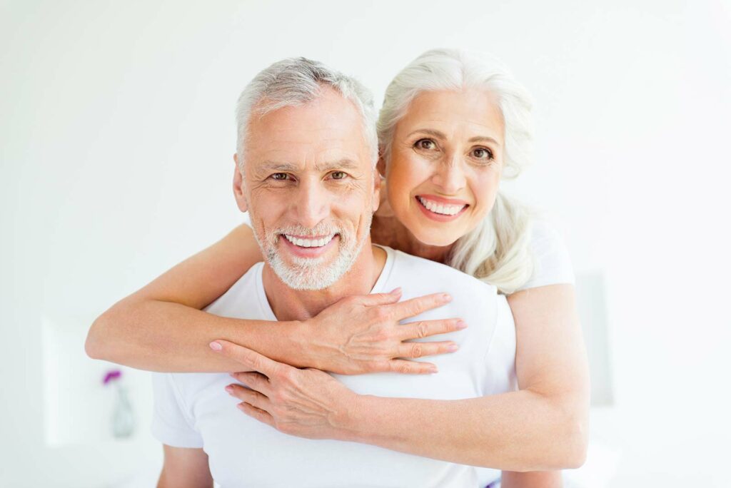 An older couple smiling together